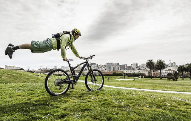 Cyclist balancing body on bike