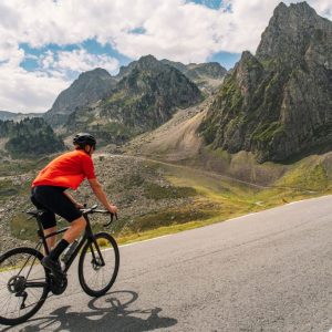 A cyclist climbing mountain