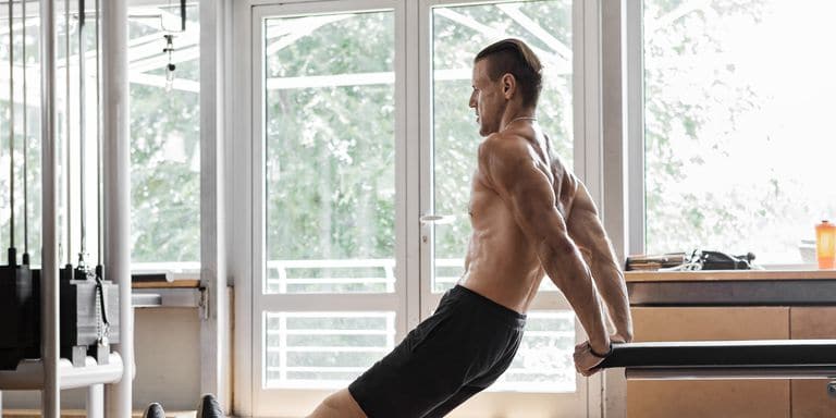 disabled-young-man-working-on-arms-dips-exercise-royalty-free-image-1008346250-1558379580