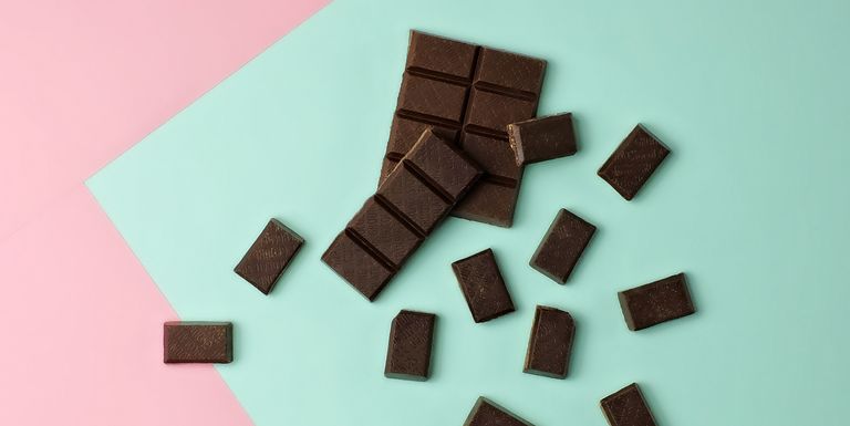 chocolate-pieces-on-color-block-background-royalty-free-image-641205034-1550000769