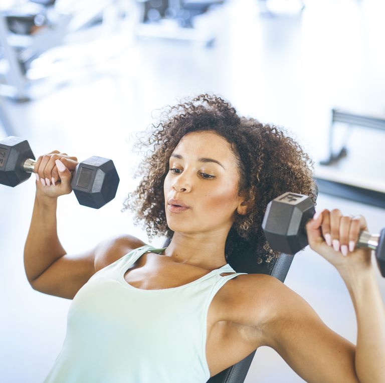 young-woman-weightraining-at-the-gym-royalty-free-image-1581355051