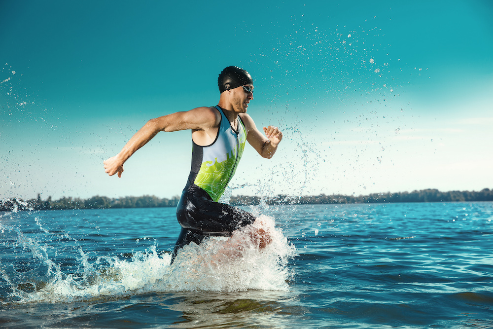 Professional triathlete swimming in river’s open water