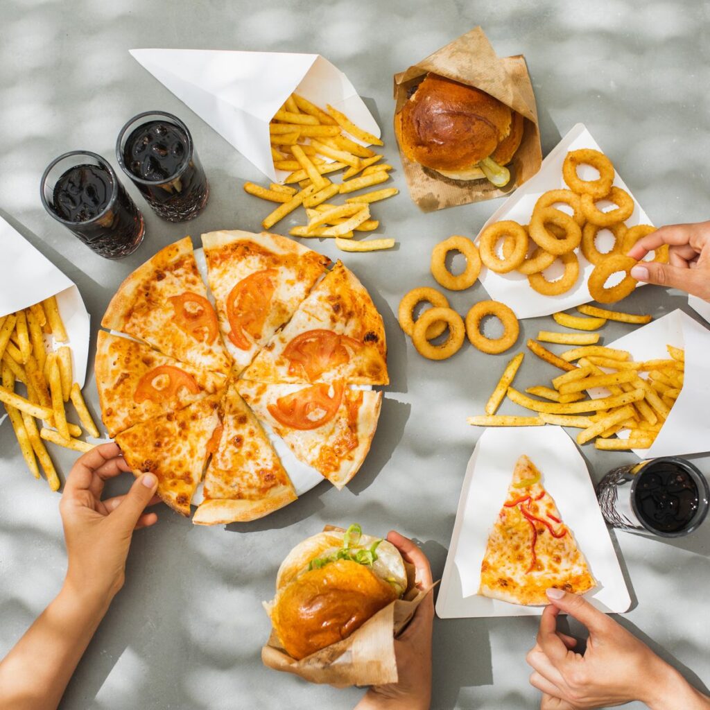 human-hands-with-assorted-take-out-food-such-as-royalty-free-image-1686586757