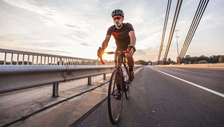 A man cycling on a road