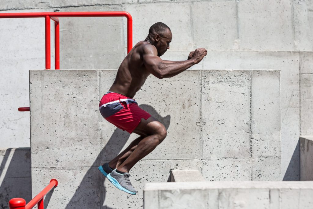 Athlete doing exercises at stadium