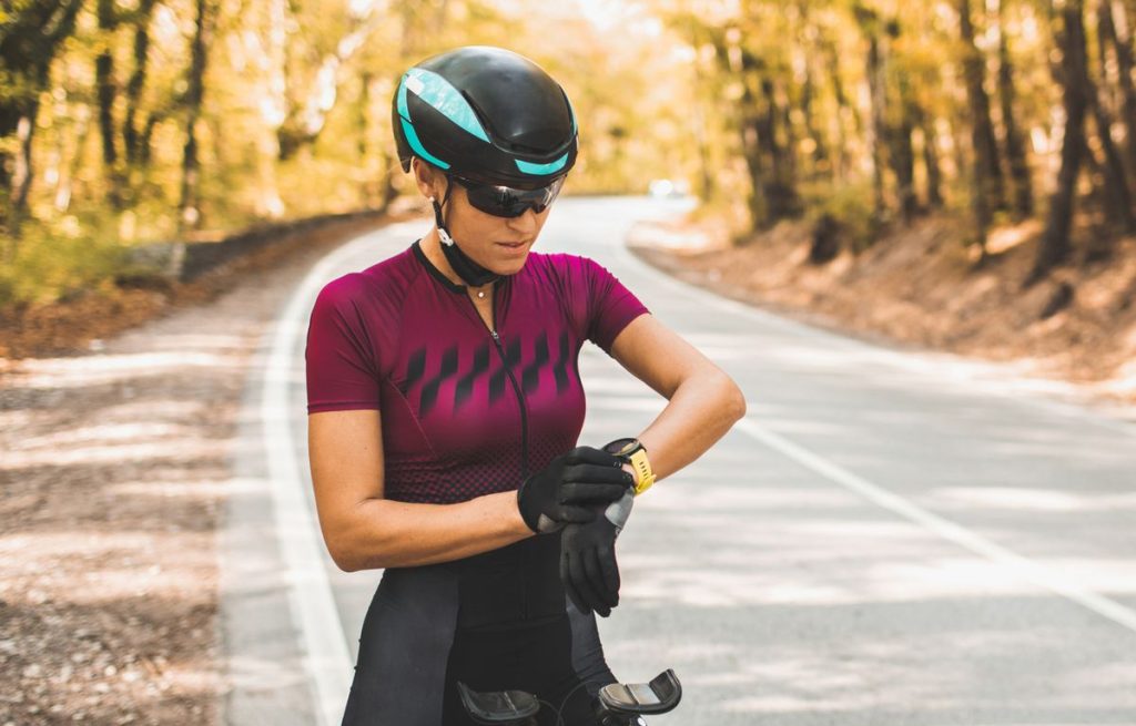 woman-preparing-for-riding-a-bike-and-checking-royalty-free-image-1650487999