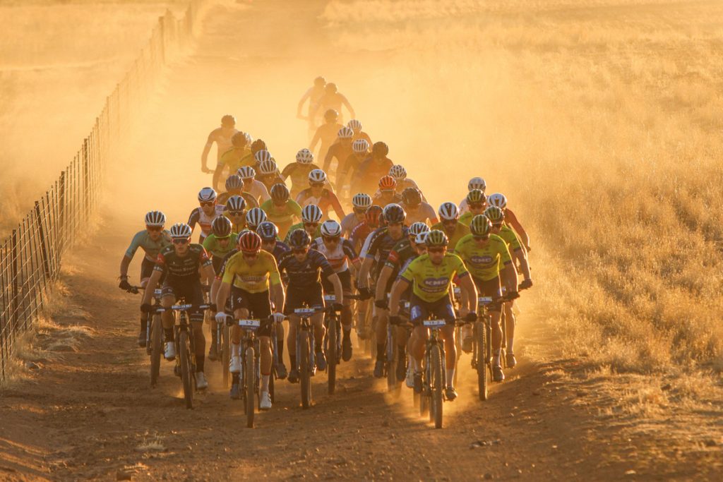 The early morning light and dust kicked up by the group made riding dangerous in the bunch and inspired Toyota Specialized’s early attack. Photo by Oakpics.com.