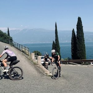 Cyclists touring Italy's Lake Garda by bike