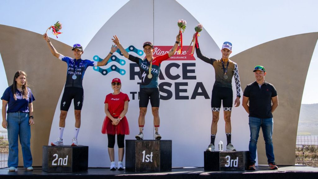 Travis Stedman (centre) was joined on the 2025 King Price Race to the Sea podium by Tristan Nortje (left) and Marc Pritzen (right). Photo by James Heron.