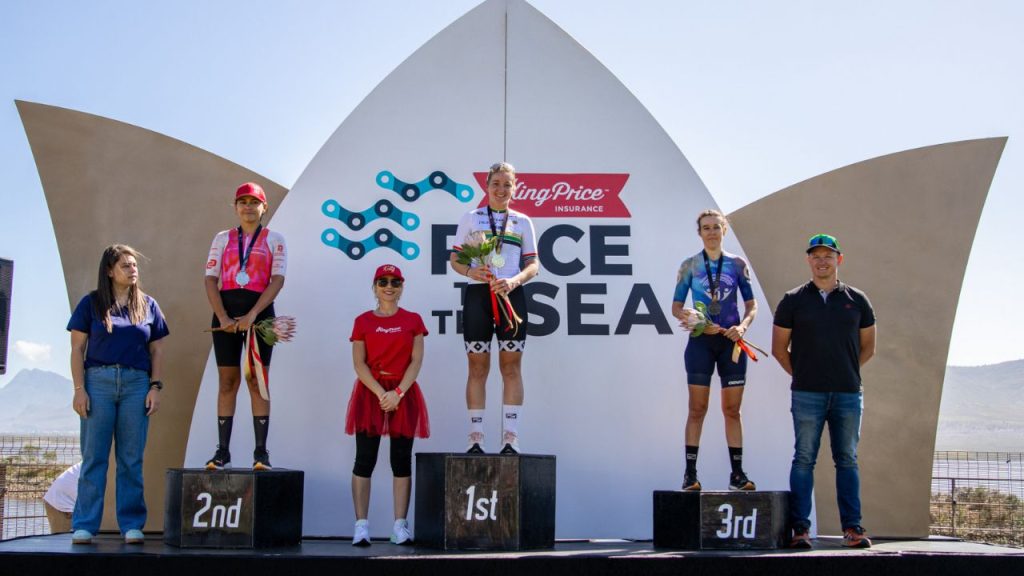 Hayley Preen (centre) flanked by Catherin Colyn (left) and Zandri Rossouw (right) on the 2025 King Price Race to the Sea elite women’s podium. Photo by James Heron.
