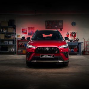 The Toyota Corolla Cross GR-S parked in the garage with bicycles