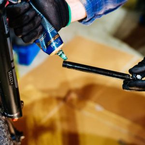 A person using bicycle grease