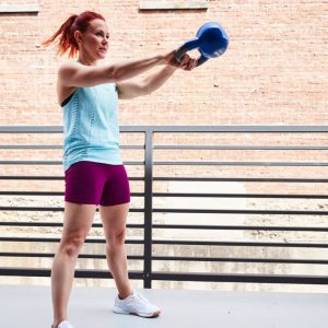 Woman doing a kettlebell workout