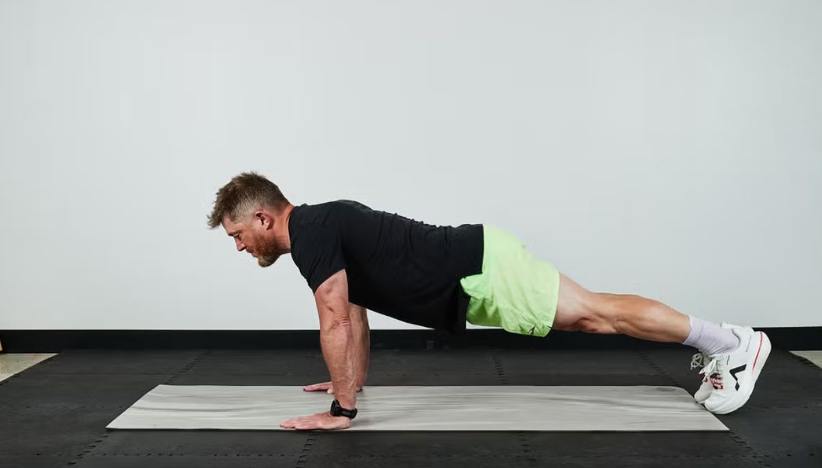 A man showing proper form for doing a push-up