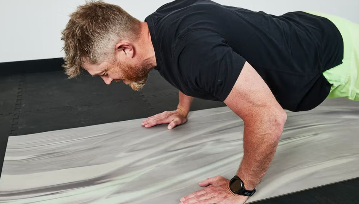A man showing the correct form for doing a push-up