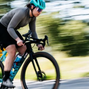 A cyclist riding with a high intensity