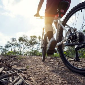 Climbing tips: A cyclist riding up a mountain trail