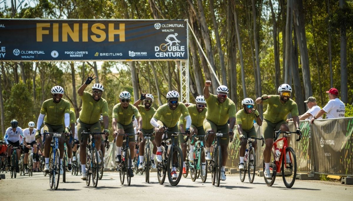 A team crossing the finish line of the Old Mutual Wealth Double Century.